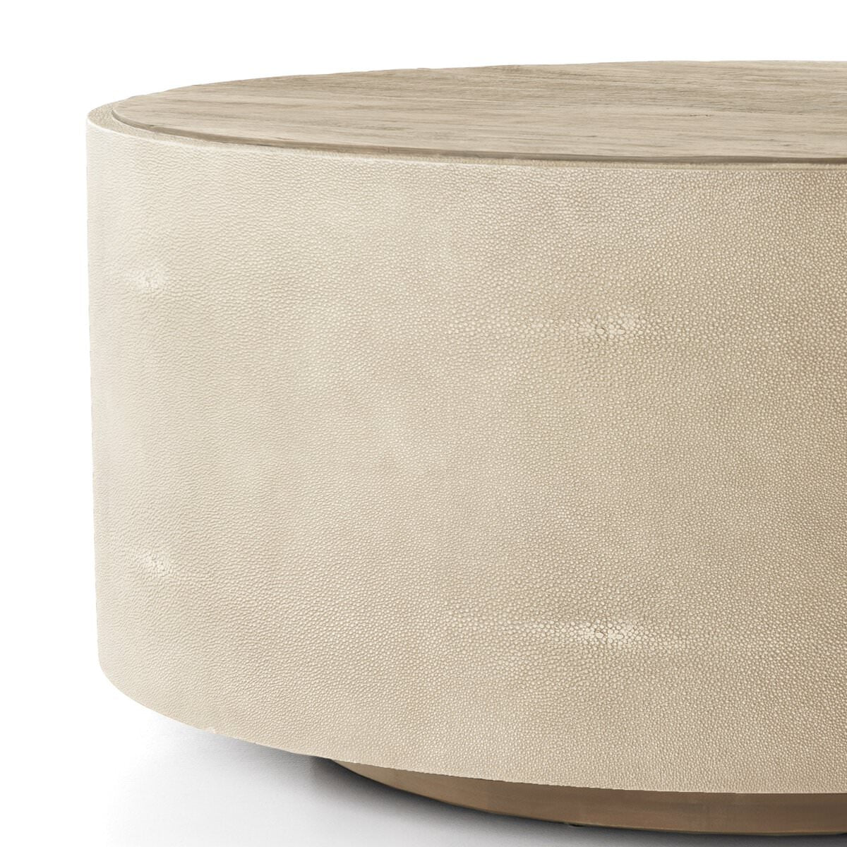 Close up of Four Hands Crosby Round Coffee Table in Light Cream on a white background