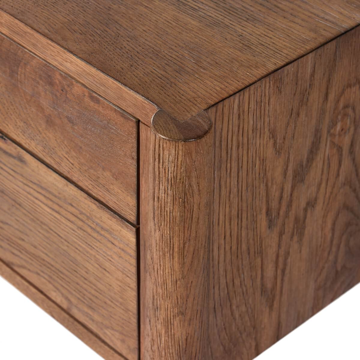 Close up of  Four Hands Glenview Desk in Weathered Oak Veneer on a white background