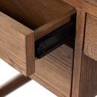 Close up of  Four Hands Glenview Desk in Weathered Oak Veneer on a white background