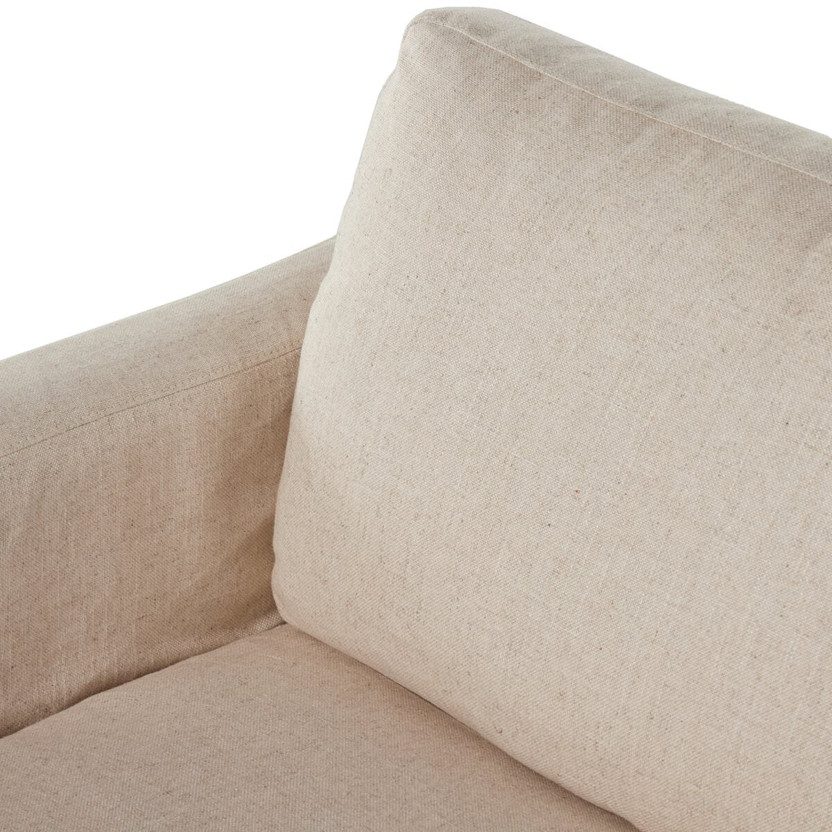 Close up of Four Hands Hampton Slipcover Swivel Chair in Evere Creme on a white background