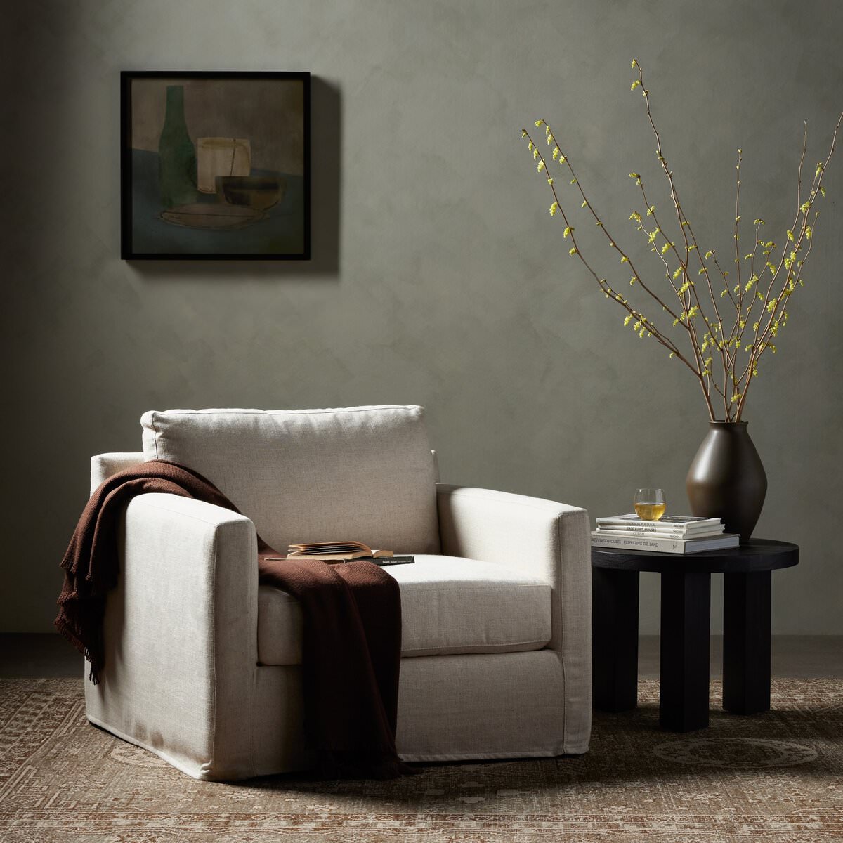 Four Hands Hampton Slipcover Swivel Chair in Evere Creme in a modern neutral living room