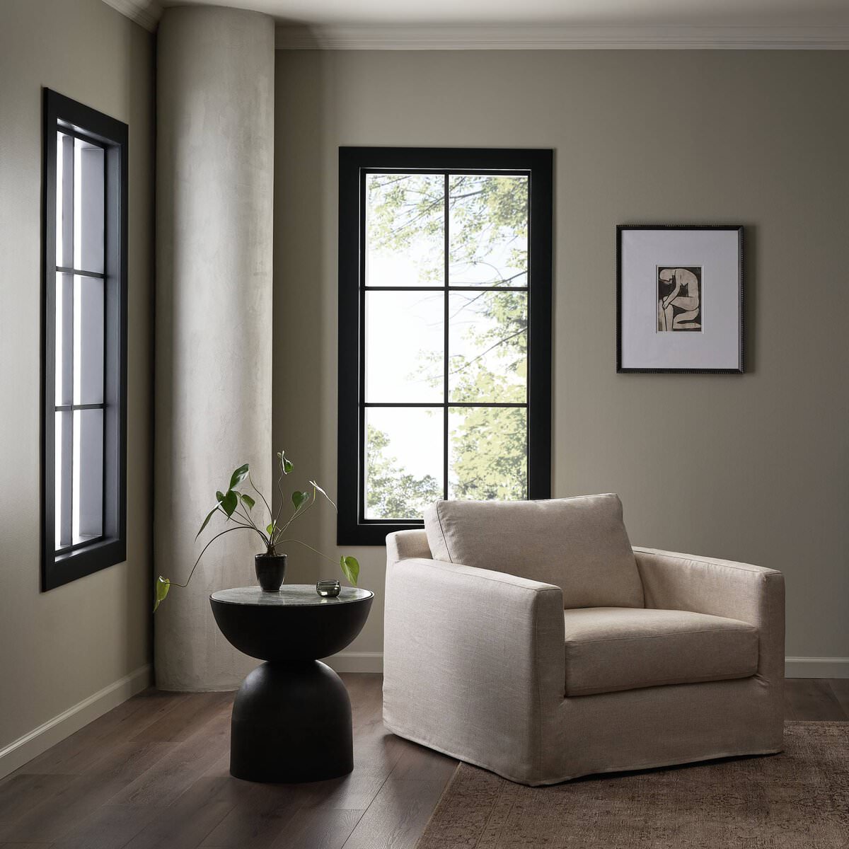 Four Hands Hampton Slipcover Swivel Chair in Evere Creme in a modern living room