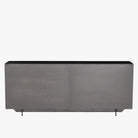 Four Hands Hendrick Sideboard with four perforated brass doors and gunmetal exterior on a white background