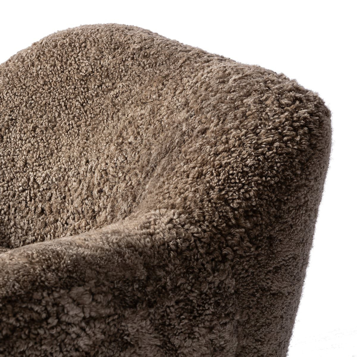 Close up of Four Hands Julius Swivel Chair in Taupe Shearling on a white background