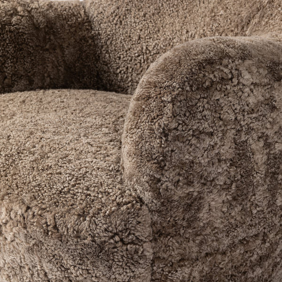 Close up of Four Hands Julius Swivel Chair in Taupe Shearling