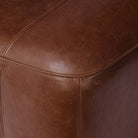 Close up of Four Hands Kylo Ottoman in Dulane Mahogany  at Addison West