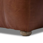 Close up of Four Hands Kylo Ottoman in Dulane Mahogany on a white background at Addison West