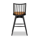 Four Hands Lewis Swivel Bar Stool in Whiskey Saddle on a white background at Addison West