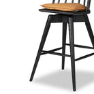 Close up of Four Hands Lewis Swivel Bar Stool in Whiskey Saddle on a white background at Addison West