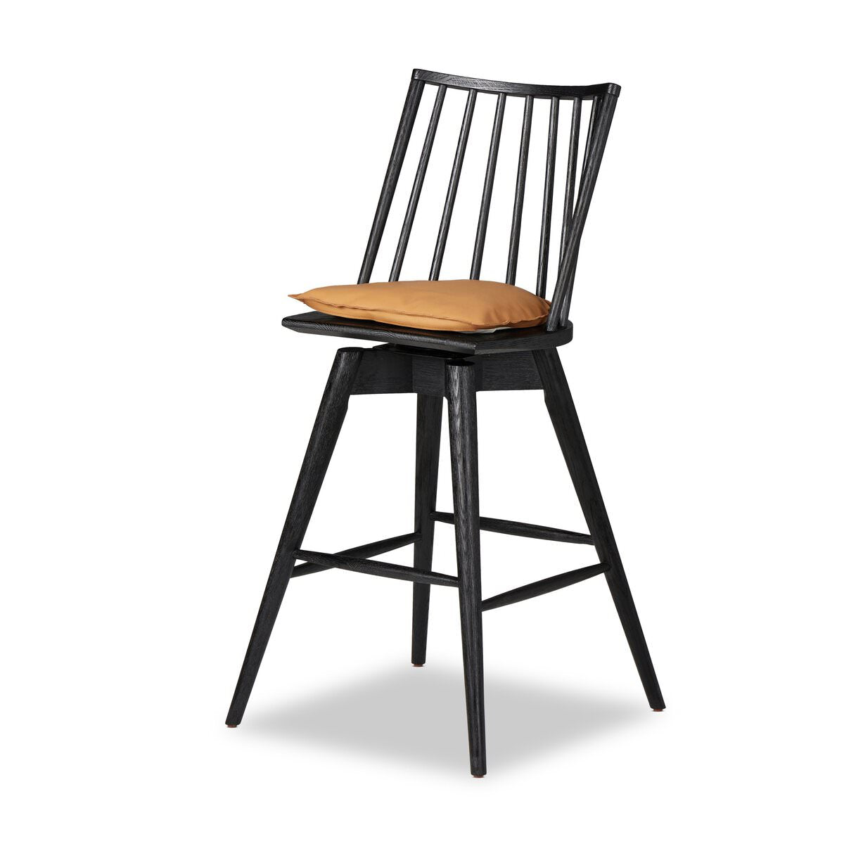 Four Hands Lewis Swivel Bar Stool in Whiskey Saddle on a white background at Addison West