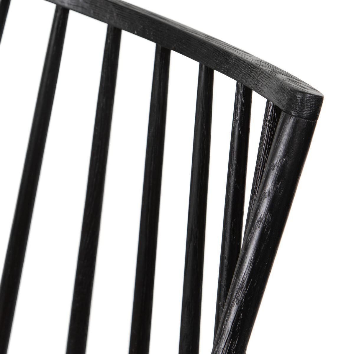 Close up of Four Hands Lewis Windsor Chair in Black Whiskey Saddle on a white background