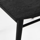 Close up of Four Hands Lewis Windsor Chair in Black oak on a white background