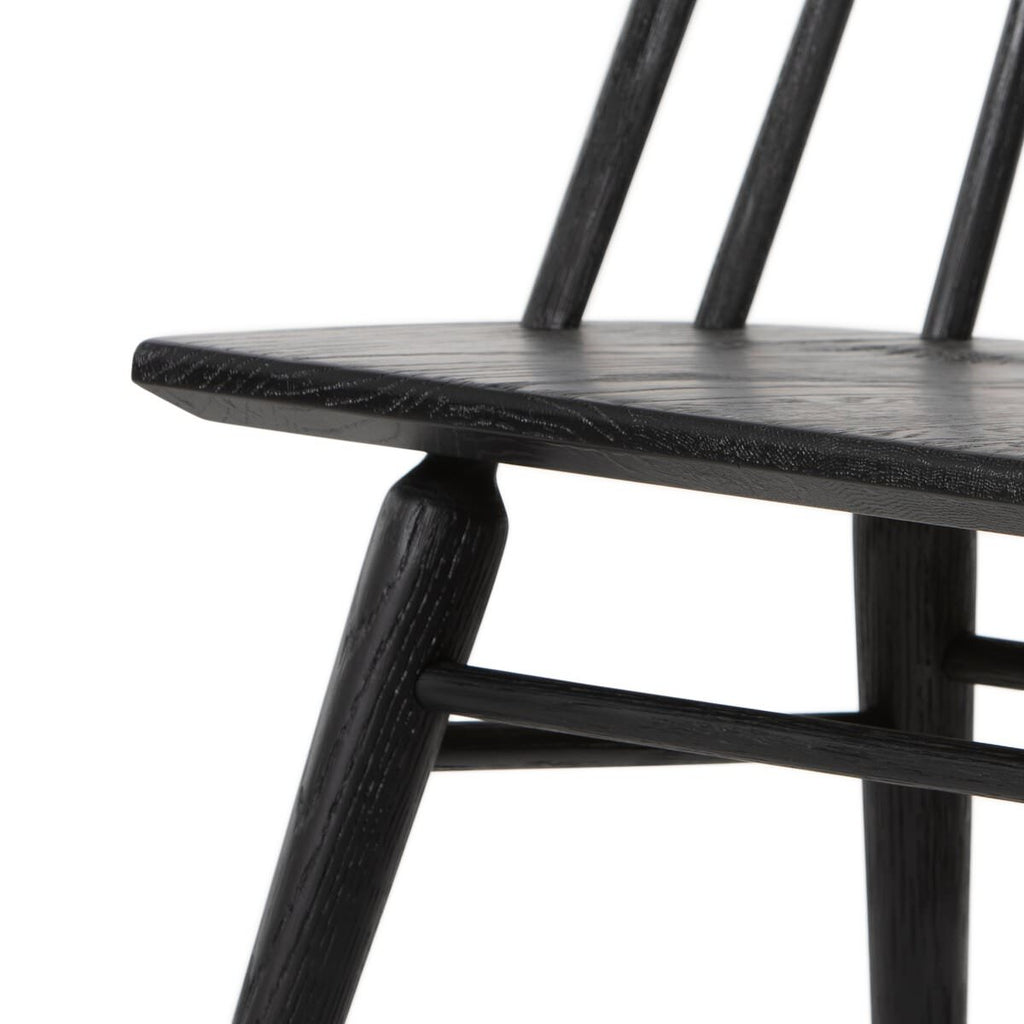 Close up of Four Hands Lewis Windsor Chair in Black oak on a white background