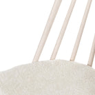 Close up of Four Hands Lewis Windsor Chair in Cream Shorn Sheepskin on a white background