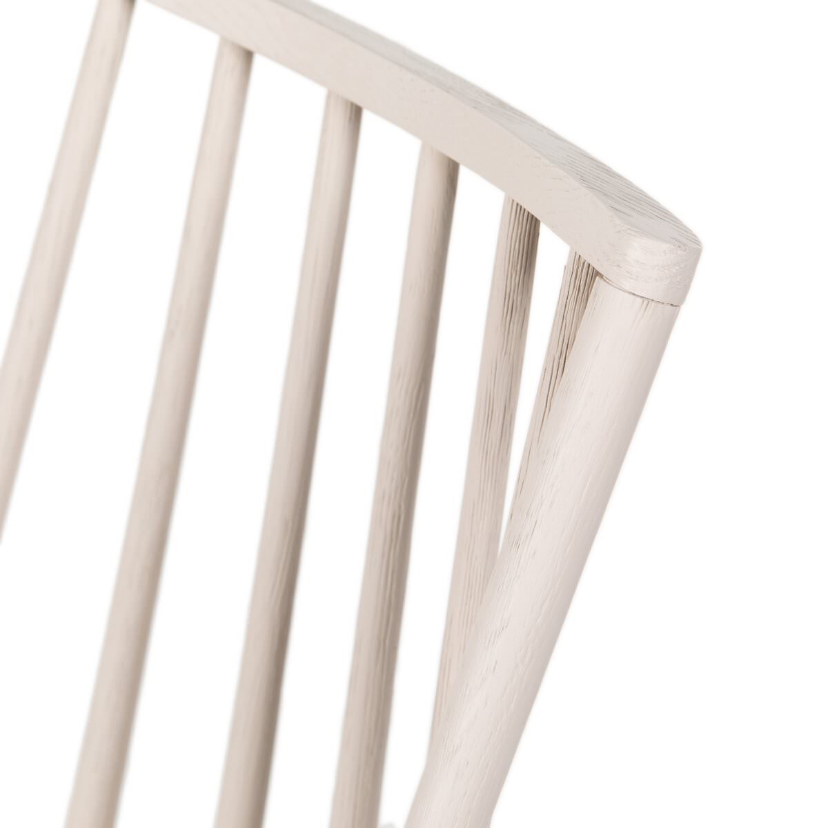 Close up of Four Hands Lewis Windsor Chair in Cream Shorn Sheepskin on a white background