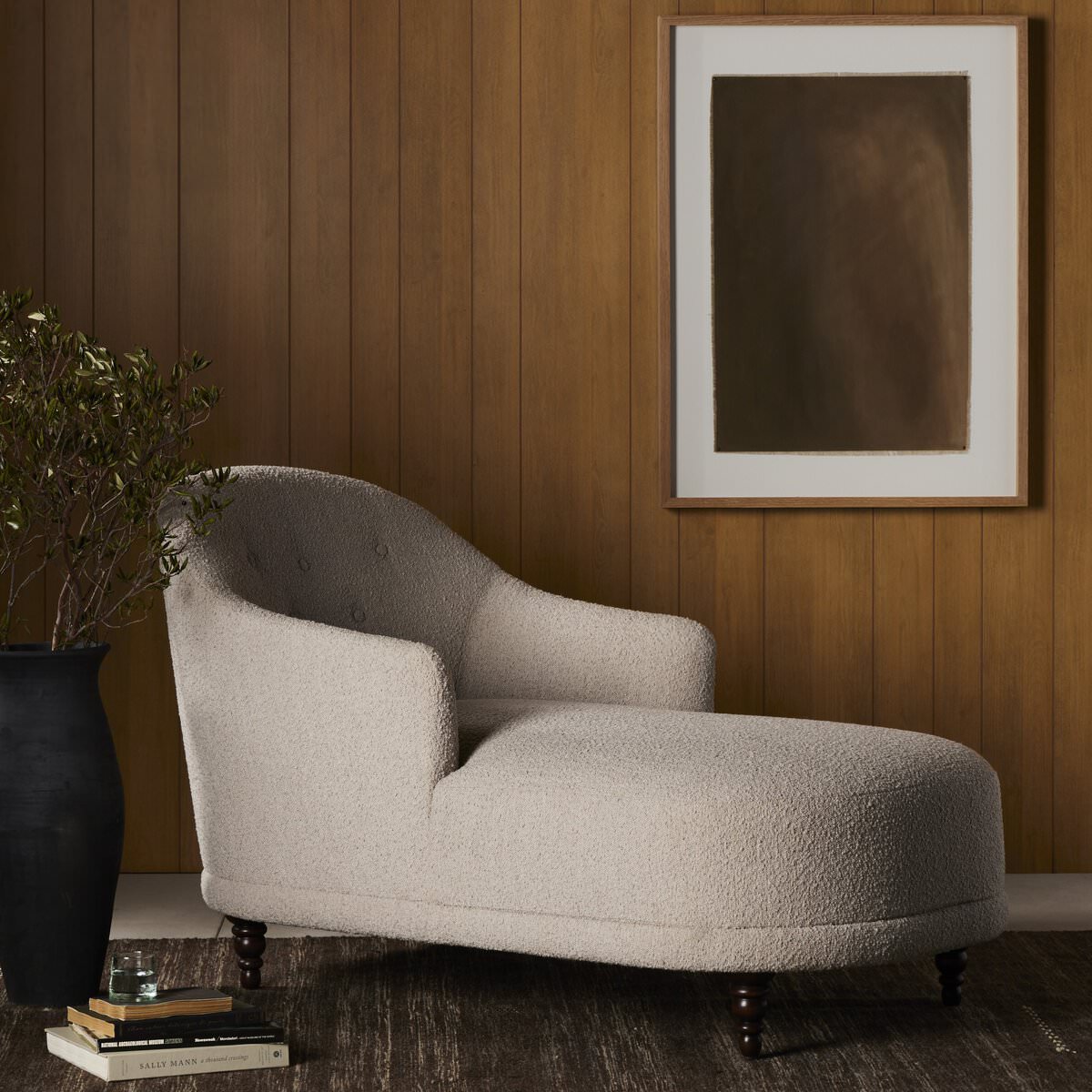 Four Hands Marnie Chaise Lounge in Knoll Sand in a modern living room with wood paneled walls