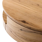 Close up of Four Hands Matheus Coffee Table in Natural Reclaimed French Oak on a white background