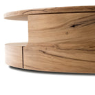 Close up of Four Hands Matheus Coffee Table in Natural Reclaimed French Oak on a white background