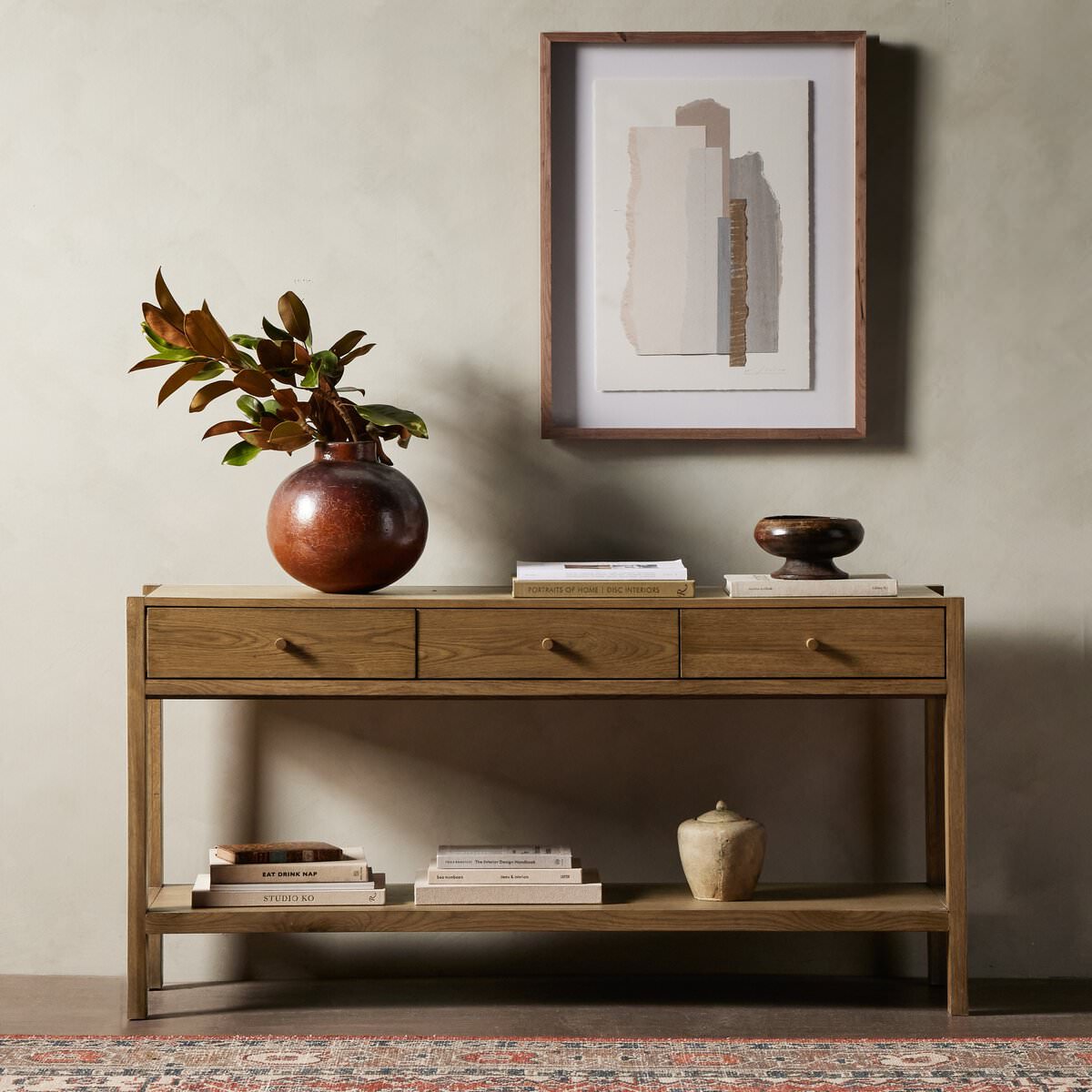 Four Hands Meadow Console against a beige wall