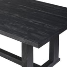 Close up of Four Hands Otto Dining Table 110" in Black Finish seats 10 on a white background