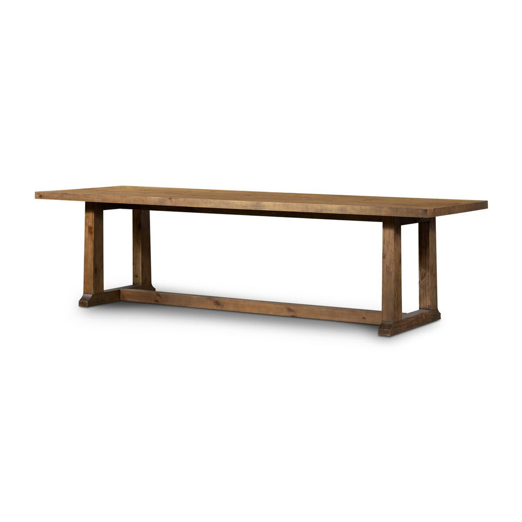 Four Hands Otto Dining Table 110" in Honey Pine on a white background