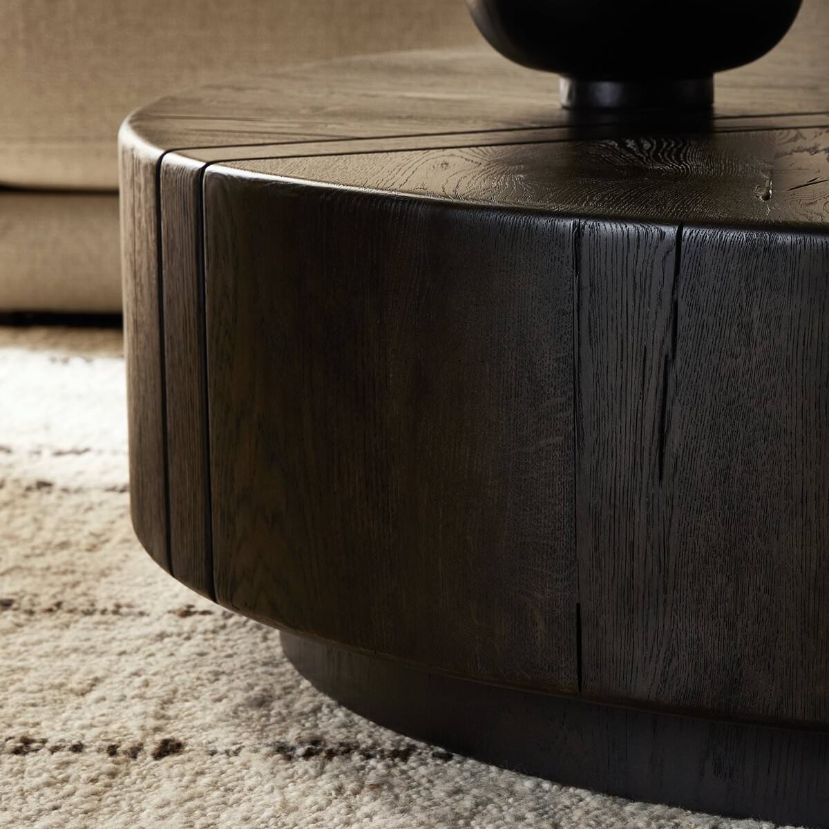 Close up of Four Hands Renan Coffee Table Dark Espresso Reclaimed French Oak in a living room