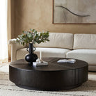 Four Hands Renan Coffee Table Dark Espresso Reclaimed French Oak in a living room