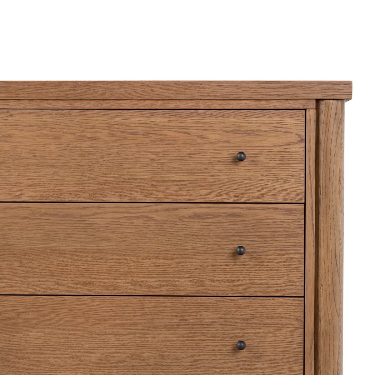 Close up of Four Hands Roark 6 Drawer Dresser in Amber Oak Veneer on a white background