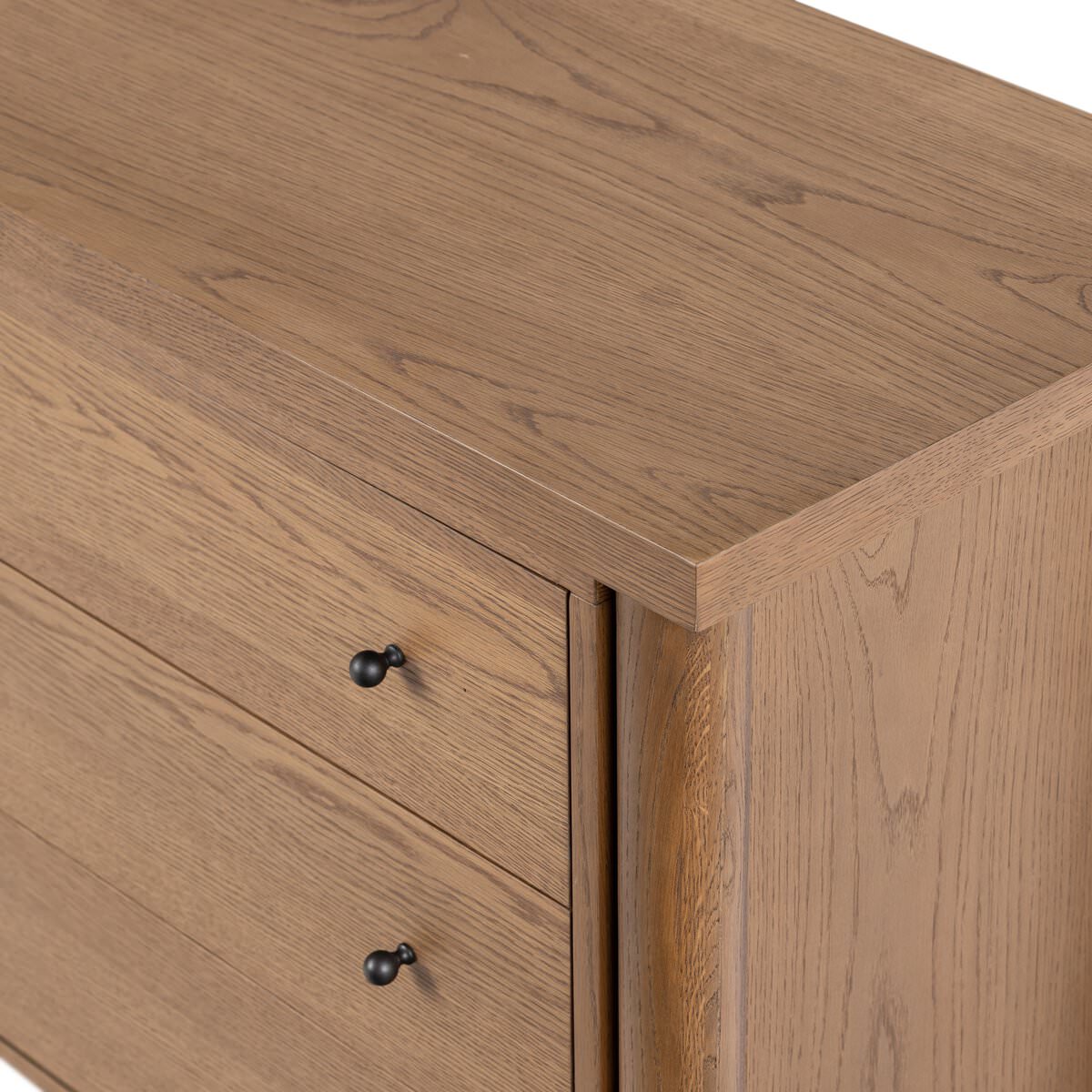 Close up of Four Hands Roark 6 Drawer Dresser in Amber Oak Veneer on a white background