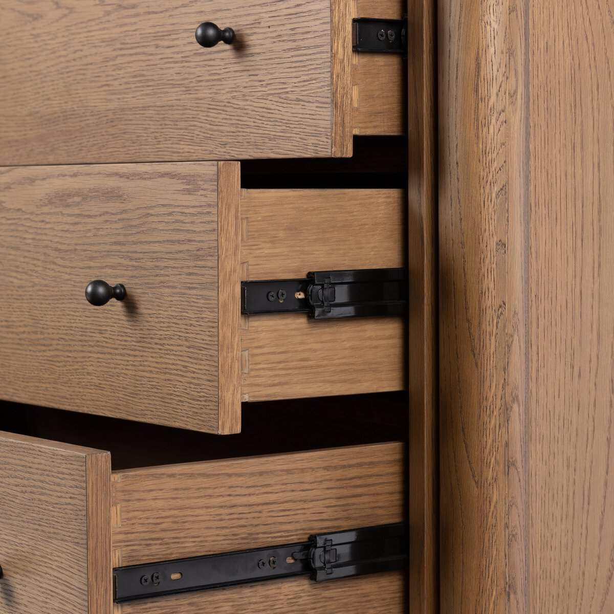 Close up of drawers of Four Hands Roark 6 Drawer Dresser in Amber Oak Veneer 