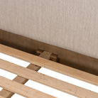 Close up of Four Hands Roark Bed in Essence Natural on a white background