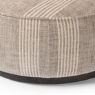 Close up of Four Hands Sinclair Large Round Ottoman in Manchester Flint on a white background at Addison West