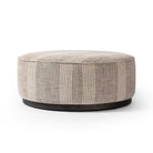 Four Hands Sinclair Large Round Ottoman in Manchester Flint on a white background at Addison West