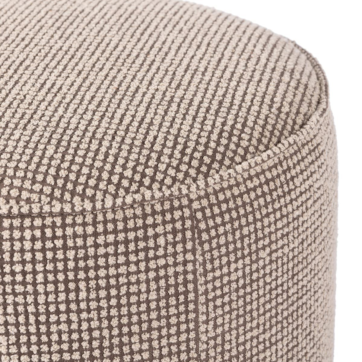 Close up of Four Hands Sinclair Round Ottoman in Barrow Taupe on a white background