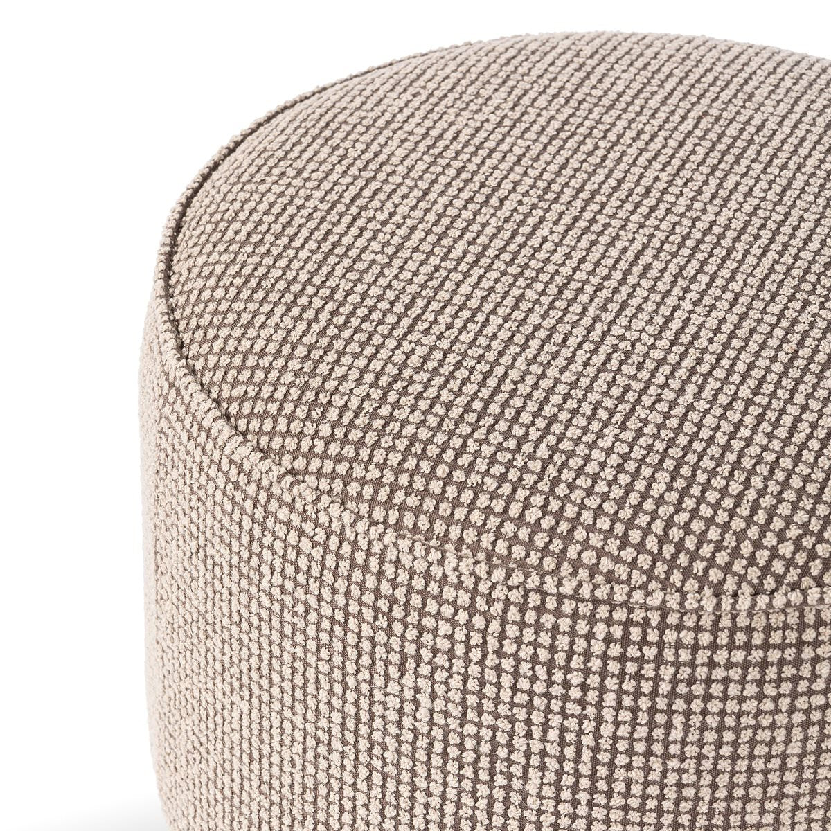 Close up of Four Hands Sinclair Round Ottoman in Barrow Taupe on a white background