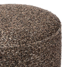 Close up of Four Hands Sinclair Round Ottoman in Ivan Granite on a white background