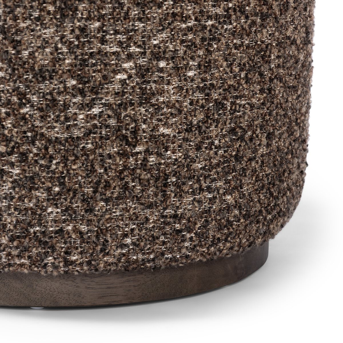 Close up of Four Hands Sinclair Round Ottoman in Ivan Granite on a white background