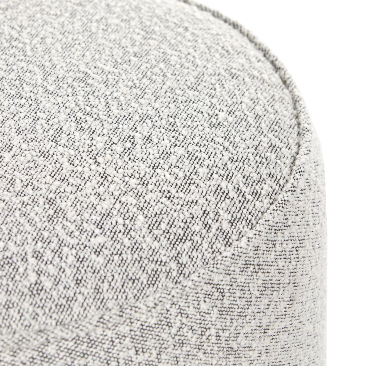 Close up of Four Hands Sinclair Round Ottoman in Knoll Domino on a white background