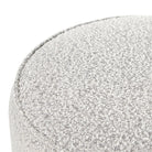 Close up of Four Hands Sinclair Round Ottoman in Knoll Domino on a white background