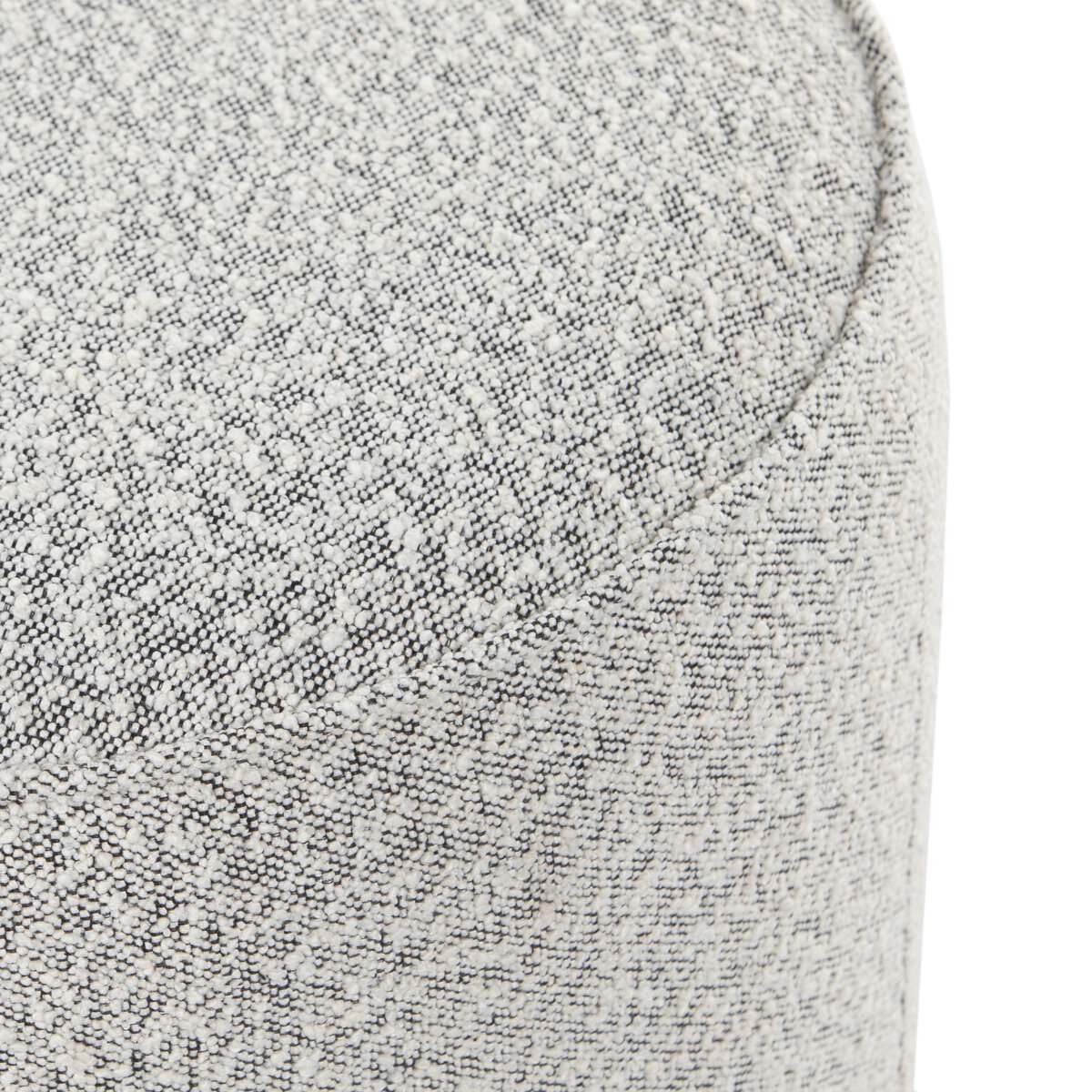 Close up of Four Hands Sinclair Round Ottoman in Knoll Domino on a white background