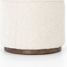 Close up of Four Hands Sinclair Round Ottoman in Knoll Natural on a white background