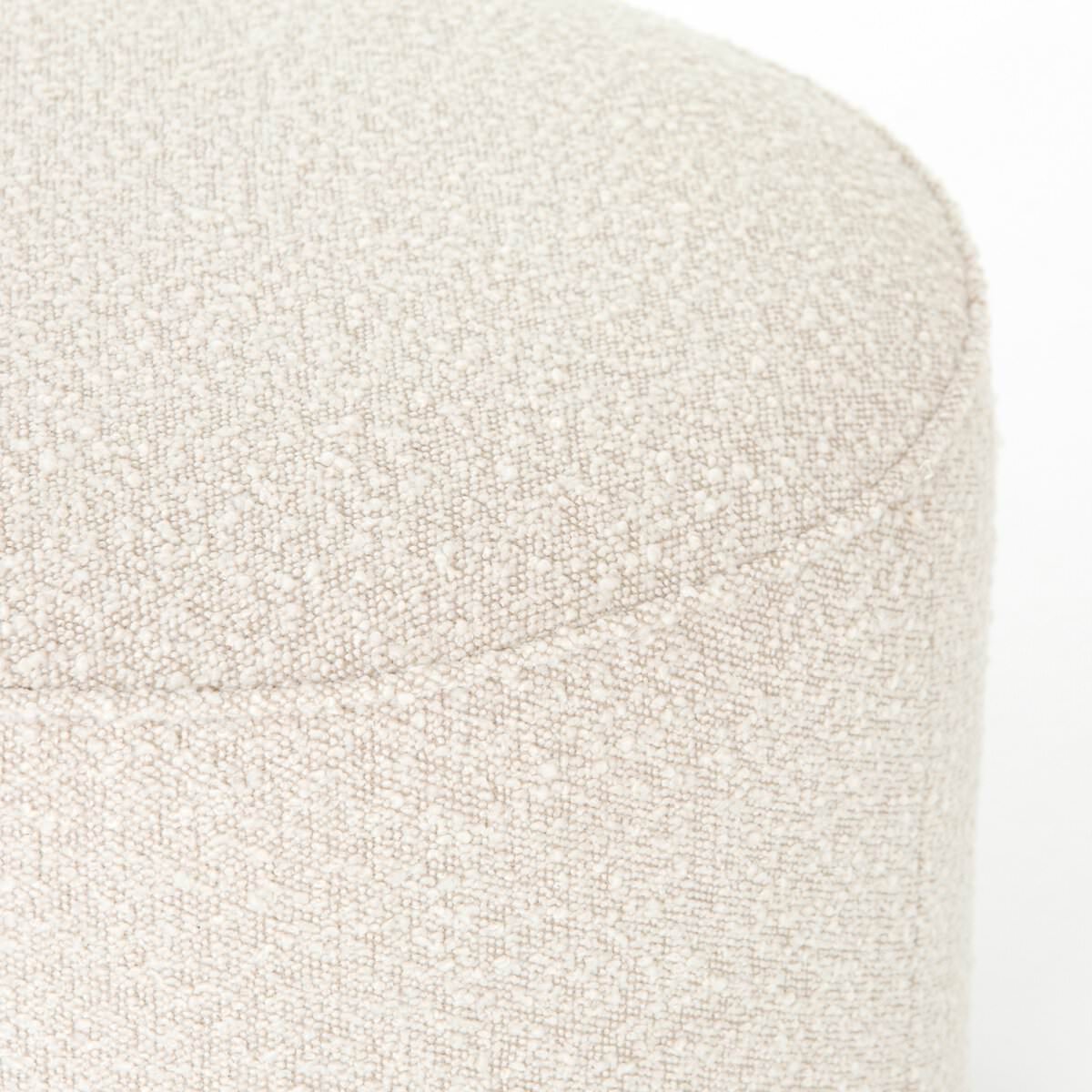 Close up of Four Hands Sinclair Round Ottoman in Knoll Natural on a white background