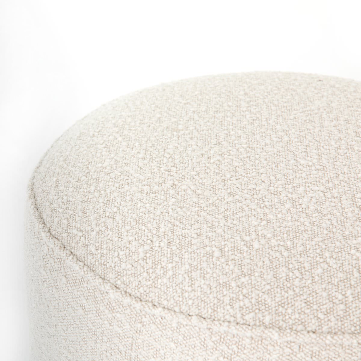 Close up of Four Hands Sinclair Round Ottoman in Knoll Natural on a white background