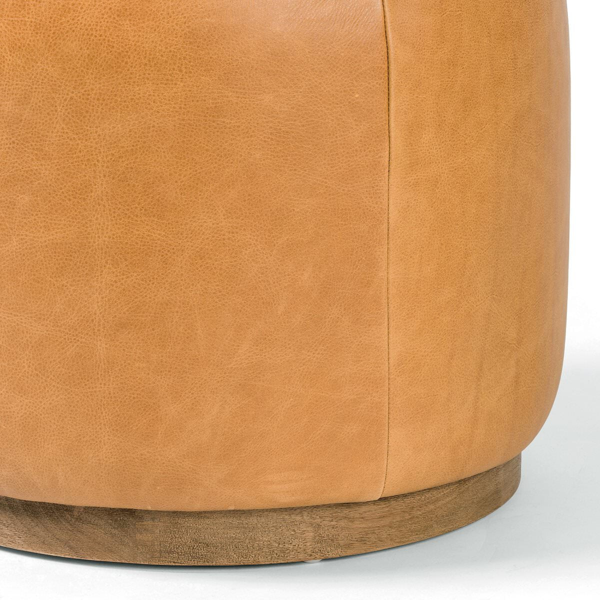 Close up of Four Hands Sinclair Round Ottoman in Palermo Butterscotch on a white background