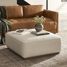 Four Hands Sinclair Square Ottoman in Knoll Natural in a living room at Addison West