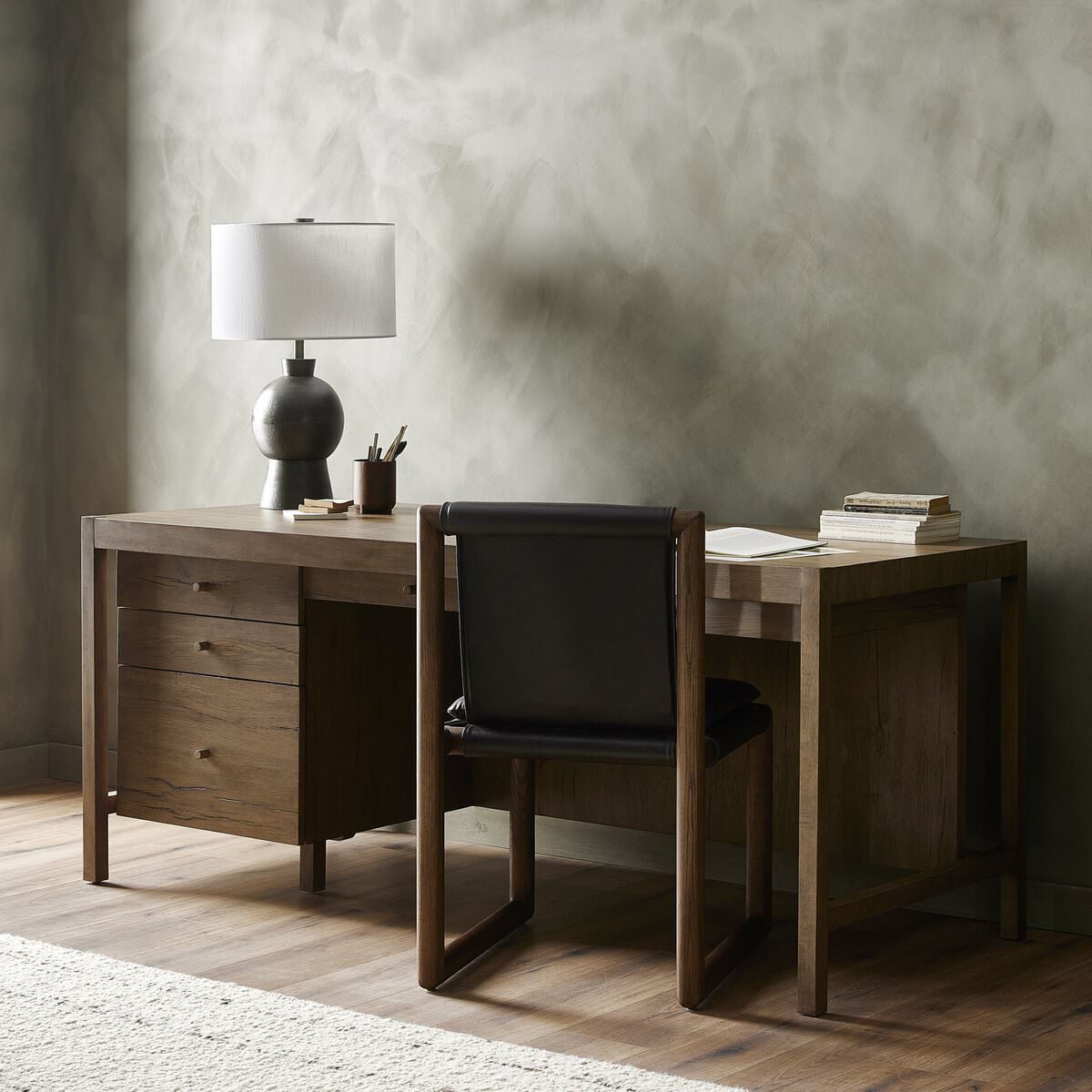 Four Hands Suspension Desk in Rustic Grey Veneer in a modern neutral office