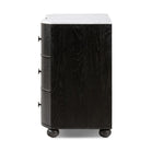 Four Hands Tiago Marble Chest in Distressed Black  from the side on a white background