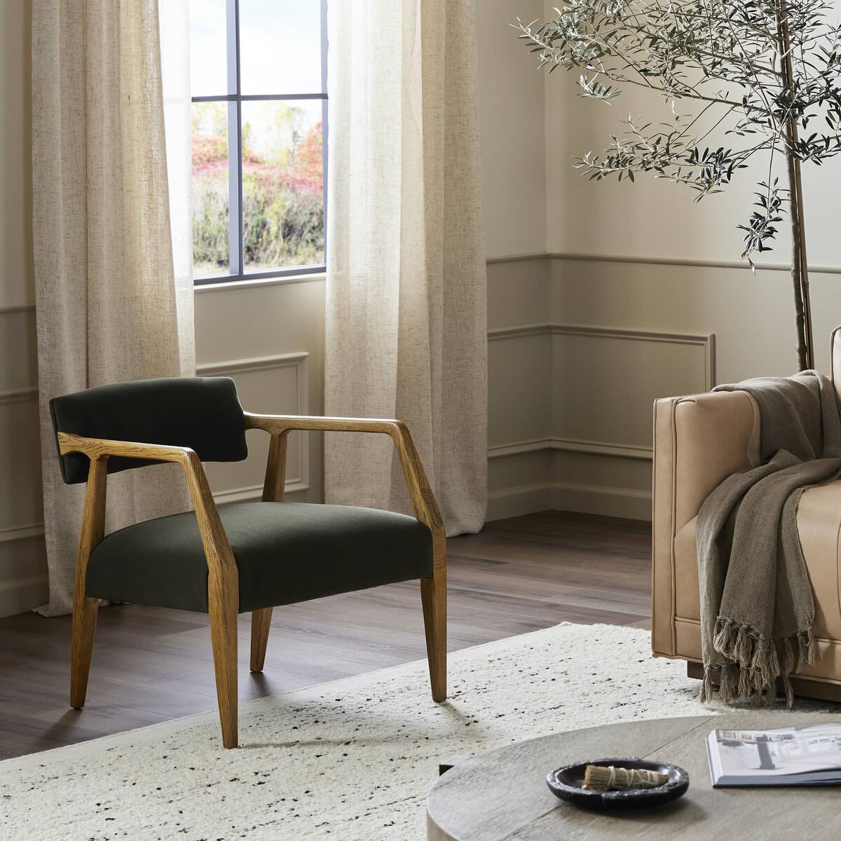 Four Hands Tyler Armchair in Modern Velvet Loden in a modern neutral living room