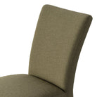 Close up of Four Hands Vista Slipcovered Dining Chair in Broadway Olive on a white background