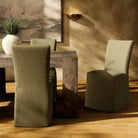 Four Hands Vista Slipcovered Dining Chair in Broadway Olive in a rustic modern dining room